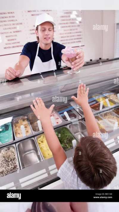 The ice cream seller asked the customer if he wanted extra nuts topping