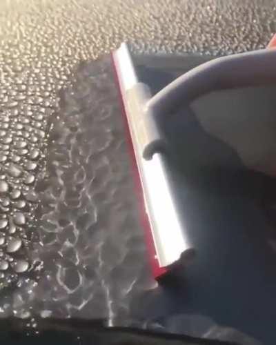 Water droplets being wiped away