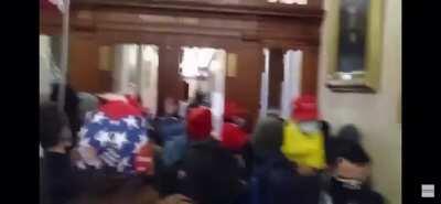 Another extended angle of the woman getting shot in the capitol building