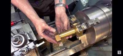 Adam Savage trying to thread a nut and bolt