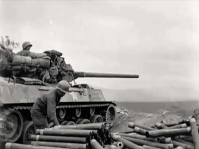 M18 Hellcat TD attacking Japanese fortified positions at Shuri on Okinawa in support of the 306th Infantry Regiment in 1945