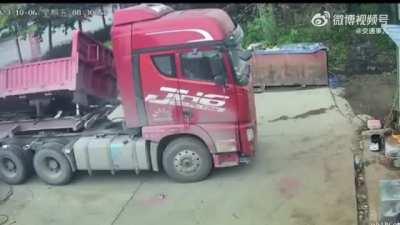 Crawling out from being under a truck bed when the hydraulics line broke/disconnected