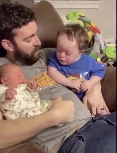 Baby reacts to baby
