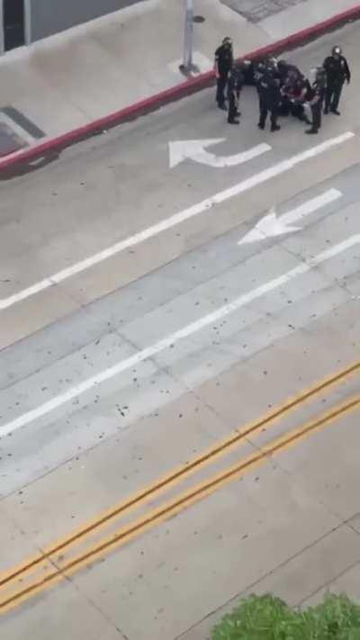 [Hollywood]: Police taze woman on the ground multiple times