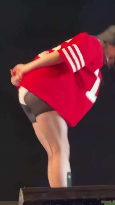 pulling up her shorts into her ass