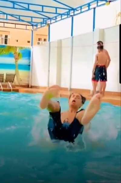 WCGW doing a back flip off someone's shoulders.