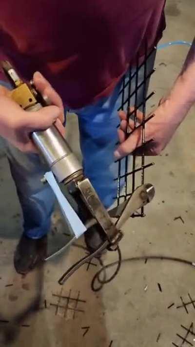 Air driven actuator, rubber band and some wire cutters. I have no need for this, but I’ll take two.