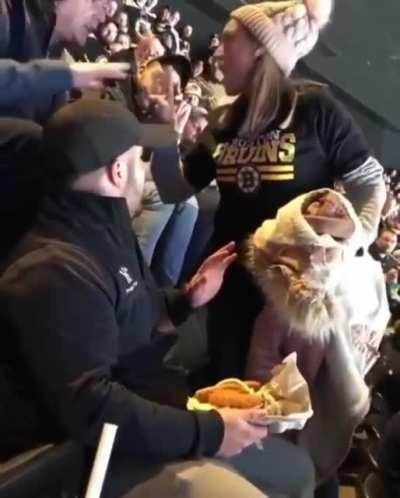 Woman freaks out over spilt food at hockey game