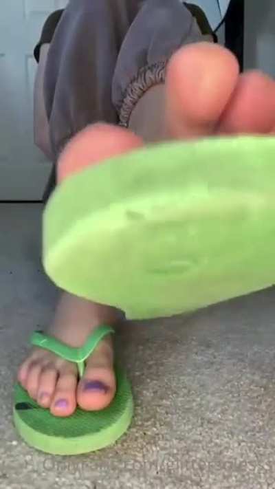 Purple toes in flip flops