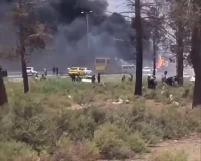 Iranian BM launcher hit on the road cooking off.