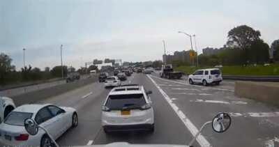 Lady in white SUV tries to bully 18-wheeler