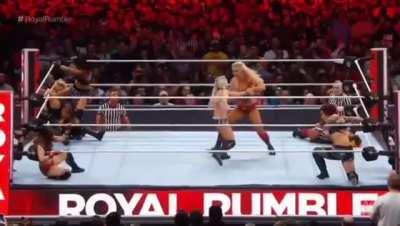 Charlotte ramming her knee deep into Alexas Abs.