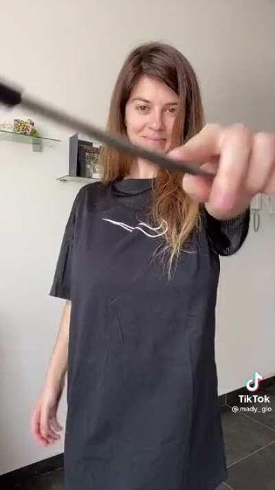 Holding items with her breast