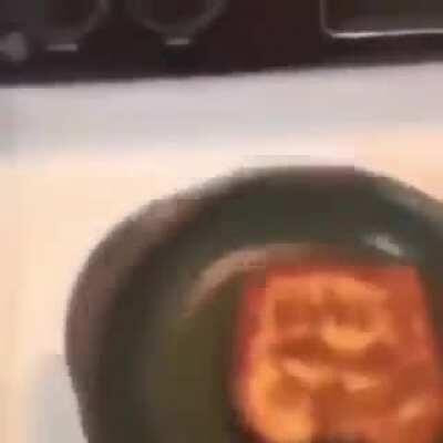 This badass fliping the toast on its side