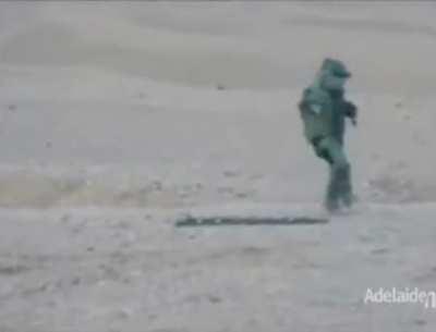 Guy dancing in an EOD suit after defusing training bomb
