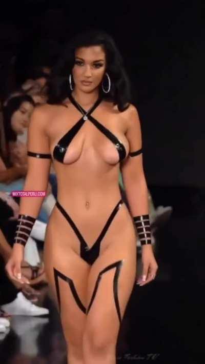 Model on stage with stripes cover tits and ass