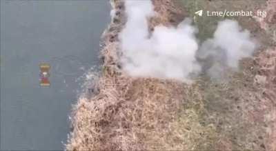 Russian soldier camouflaged in tall grass on riverbank spotted and neutralized by Ukrainian military