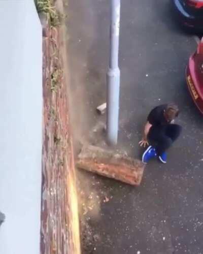 Guy breaks foot after a wall falls on him.