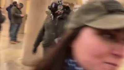 This genius tells his wife to put her mask back on so she can't be IDed by the feds... and then uploads her face to social media. Husband of The Year material!