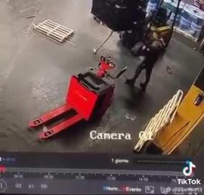 OSHA Approved method of removing an errant piece of wood from a pallet.