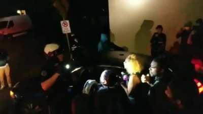 Protesters get knocked to the ground after swarming police motorcycle - 2 angles - Portland 2nd October