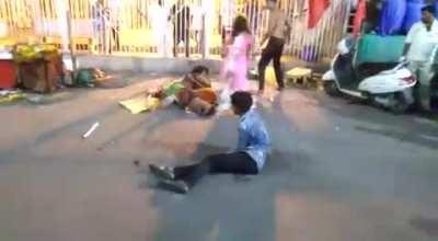 A different kind of fight in a busy indian market.(1v3)