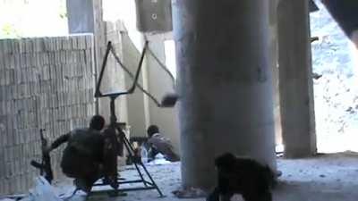 FSA fighters use a slingshot to lob explosives at Syrian Army held positions during fighting in Aleppo - 9/24/2012