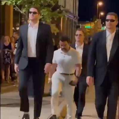 Man needs a private security escort to transport all that cake