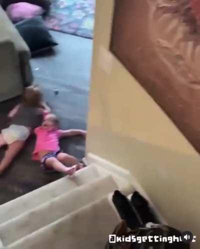 This pendejota mother being naughty letting two babies carry each other down the stairs