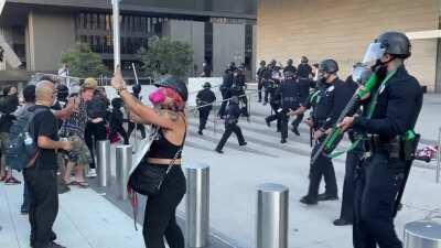 LAPD stand-off with protesters during a Portland Solidarity march on 7/25. One officer completely loses his cool and opens fire on unarmed protesters, using his shotgun at point blank range. This guy doesn’t have the composure for this job.