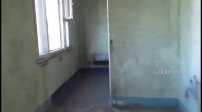 Russian tank shooting at civilian filming from apartment building 25km west of Kyiv