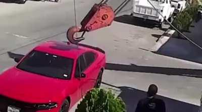 What a nice car, it'd be a shame if it got hit by that crane hook