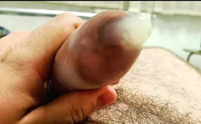 Filling a condom with my uncut cock