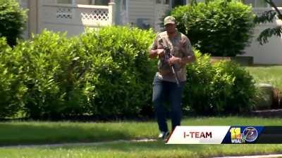 Man walks around with assault rifle at school bus top