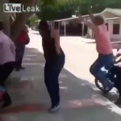 Two guys on a bike roll up...