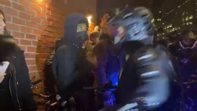 NYC: Far-left protester calls an officer a fascist and spits in his eyes.