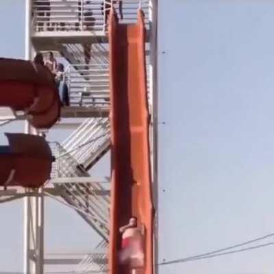 Swimming in front of the end of a waterslide