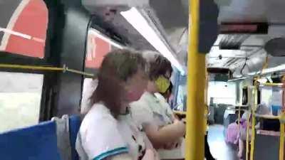 Homophobic man harrasses two kids and their mom inside a bus