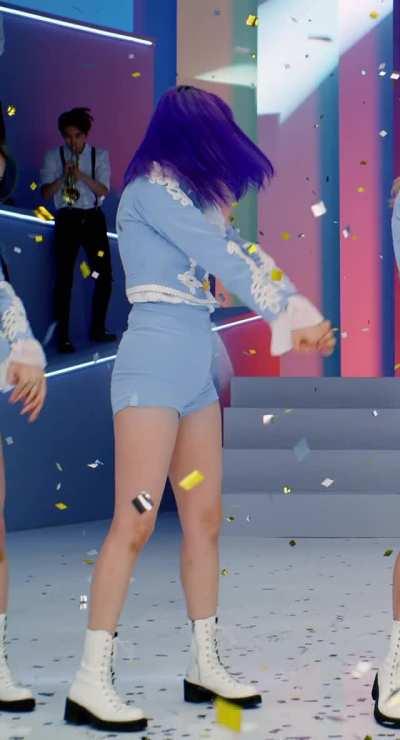 Jeongyeon - purple hair, light blue fanfare outfit, shorts, top
