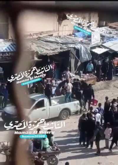 Armed Hamas man beating hard kids in Khan Yunis