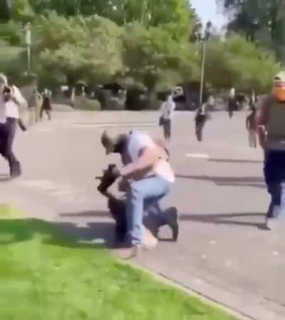 Proud Boys throw woman to the floor, pin her there, and attack her