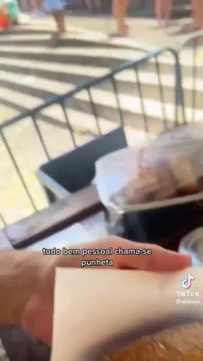 Tourist delights himself with a traditional Brazilian snack, the punheta 😋😋 uma delícia
