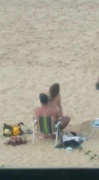 A couple having sex on the beach