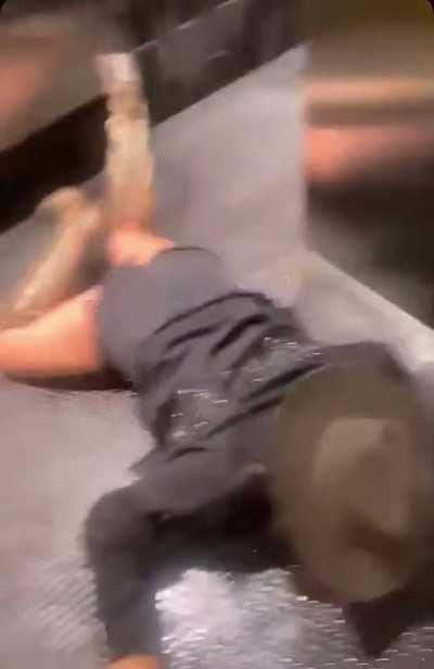 Playing with a wet floor sign