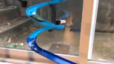 Just a hot wheels car entering a tunnel...