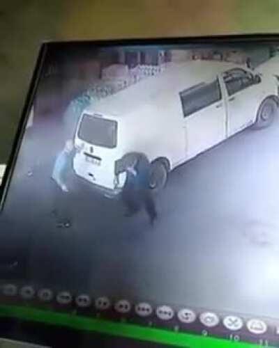 Two guys slam into each other while walking