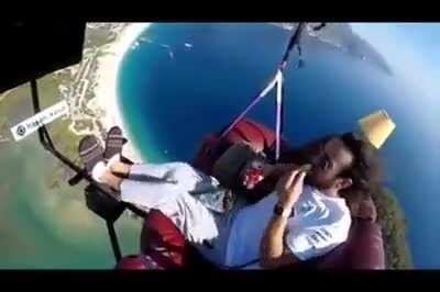 Man attempts to paraglide with couch