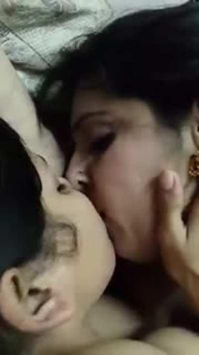Indian lesbians kiss passionately while the man films