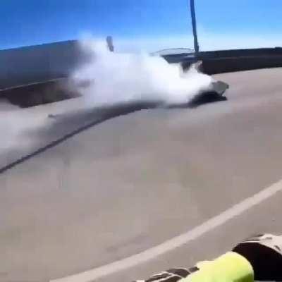 Squid in T-shirt showing off a wheelie and crashes into another squid's fallen motorcycle.