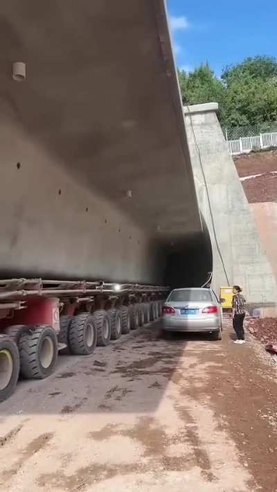 Semi-trailer Transports Precast Bridge Through Narrow Space
